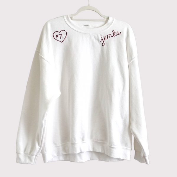 Solid crewneck with two designs.